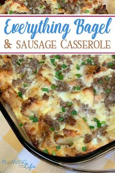 a casserole dish with sausage and green onions in it on a checkered table cloth