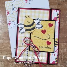 a close up of a card with a bee on it