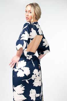 Introducing the Kazu Dress, a captivating design crafted with meticulous attention to detail. Made in a beautiful blue and cream floral print, it features a wrap-around bodice that creates a flattering and adjustable fit, embracing every body type. The straight-line skirt flows effortlessly, lending an air of elegance to your every step, while the bareback design with its arched detailing adds a touch of sensuality. Completing the look, the kimono sleeves provide a hint of relaxed refinement and Smooth Jazz Music, Dress With Kimono, Cotton Wedding, Bespoke Fashion, Kimono Sleeves, Blue And White Floral, French Seam, Kimono Sleeve, Clothing Labels