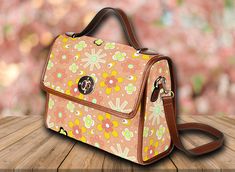 "Retro 70s Hippies Groovy floral Canvas Satchel bag, Cute women boho crossed body purse, cute vegan leather strap hand bag, hippies boho gift >>PRODUCT INFO<< * 18.94 Oz. Made from high-grade waterproof canvas, durable, water-resistant. * Can be used as a nice laptop storage bag, business briefcase, college school bag, leisure travel tote bag, crossbody messenger bag, card wallet case, etc. * Two interior pockets for small items one zipper pocket. * Removable and adjustable shoulder strap. * The Bohemian Handheld Satchel, Hippie Brown Crossbody Shoulder Bag, Cottagecore Handbag, Bohemian Brown Satchel For On-the-go, Retro Floral Print Bags For Daily Use, School Bag College, Boho Cross, Business Briefcase, Travel Tote Bag