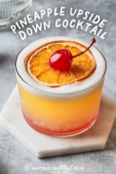 the pineapple upside down cocktail is garnished with orange slices and a cherry