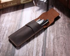 "This rustic leather pencil holder was made completely by hand with high quality genuine leather, available in 3 color: Brown, Coffee, Wine. It is perfect for your fountain pen, we can stamp 1-3 initials for you by free service, please leave us a note when you place the order. --------------------------------------------------------- H O W ∙ T O ∙ O R D E R 1. Select options from the drop down menu 2. Enter detailed personalization in box. 3. Add to cart. **Please follow any guidelines and limit Leather Pencil Pouch, Leather Pencil Case, Leather Organization, Slim Leather Wallet, Coffee Wine, Pen Pouch, Pencil Bag, Brown Coffee, Card Sleeve