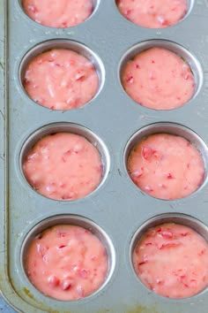 a muffin tin filled with cupcake batter