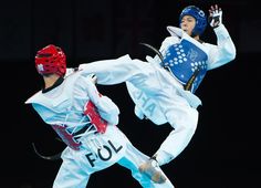 two people in the air doing karate moves