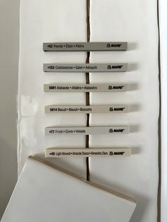 several pieces of paper are stacked on top of each other in order to form a vertical line