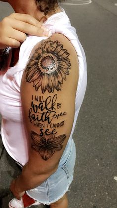 a woman with a sunflower tattoo on her arm