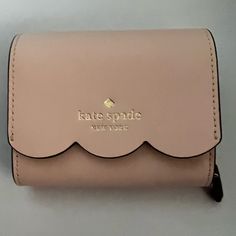 Never Used, Kate Spade Wallet. Perfect Condition Compact Kate Spade Wallets As Gifts, Compact Kate Spade Wallet, Blush Rectangular Wallet With Card Slots, Kate Spade Coin Purse With Card Slots, Compact Kate Spade Coin Purse, Kate Spade Leather Wallets As Gift, Kate Spade Beige Wallet For Everyday Use, Kate Spade Beige Wallets For Everyday Use, Elegant Kate Spade Coin Purse For Travel