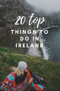 two people sitting on the grass with text overlay reading 20 top things to do in ireland