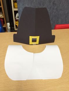 a paper hat sitting on top of a table