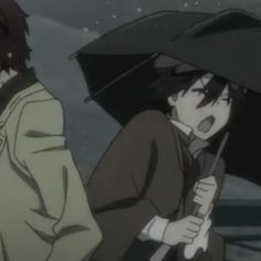 two people standing in the rain with umbrellas over their heads and one person holding an umbrella