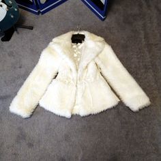 This Is A Gorgeous Never Worn Ivory Fur Jacket With Cinched Waist. Looks Beautiful Dressed Up Or With Jeans. Never Worn And Comes With Extra Buttons. Size Small Modacrylic, Acrylic, Polyester White Winter Outerwear With Faux Fur Lining, White Outerwear With Faux Fur Lining, White Fur Coat With Faux Fur Lining, White Faux Fur Lined Coat, Winter White Long Sleeve Blazer For Winter, Winter White Long Sleeve Blazer, Fitted Winter White Outerwear With Faux Fur Lining, White Long Sleeve Fur Coat For Spring, White Long Sleeve Spring Fur Coat