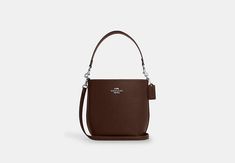 Double face leather Inside zip pocket Snap closure fabric lining Detachable handle with 8 drop Detachable strap with 22 3/4 drop for shoulder or crossbody wear 6 1/2 (L) x 8 1/4 (H) x 4 1/2 (W) Style No. CT801 Coach Outlet, Double Face, Shoulder Bag Women, 4 H, Snap Closure, Bucket Bag, Zip Pockets, Outlet, Shoulder Bag