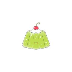 a green cake with a cherry on top