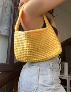 Borsetta a spalla con manico corto realizzata all'uncinetto con filo 100% acrilico molto resistente di color giallo canarino.  Le dimensioni sono:  -larghezza 28 cm -altezza 15 cm  -manico 42 cm Capiente nonostante le dimensioni e molto leggera.  Lavabile il lavatrice a 30 gradi o a secco. Non utilizzare candeggina! Se la desideri di un altro colore o di diverse dimensioni è possibile personalizzarla! Scrivimi per farmi sapere le tue modifiche! :) Yellow Casual Crochet Bag For Spring, Casual Yellow Crochet Bag For Spring, Trendy Yellow Crochet Bag, Yellow Crochet Bag For Spring, Spring Yellow Crochet Bag, Trendy Handmade Yellow Crochet Bag, Trendy Yellow Handmade Crochet Bag, Trendy Yellow Crochet Bag For Everyday, Trendy Yellow Crochet Bag For Everyday Use