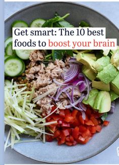 a plate filled with vegetables and meats on top of a blue tablecloth that says get smart the 10 best foods to booster your brain