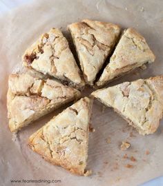 a pie cut into eight pieces sitting on top of a piece of parchment paper