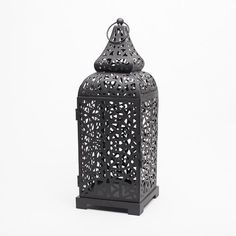 an ornate black candle holder on a white background with the word love spelled in arabic