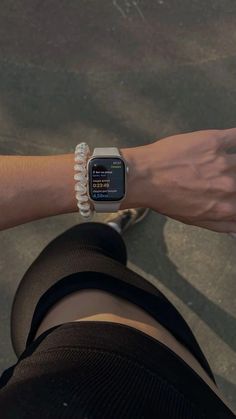 a person wearing an apple watch on their wrist