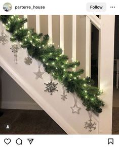 the stairs are decorated with christmas decorations and garlands on them, along with snowflakes