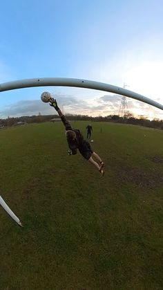 a man flying through the air while riding a kiteboard