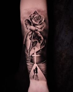 a person with a rose on their arm and an arrow in the middle of it