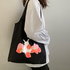 Hop into style with our Strawberry Bunny Tote Bag! Featuring a cute strawberry and bunny design, this canvas tote bag is both durable and lightweight, making it perfect for carrying your everyday essentials. Its spacious interior provides plenty of room for all your belongings, ensuring convenience and style on the go. Whether you're running errands or heading out for fun, this tote bag is a charming and functional companion. Bunny Canvas, Strawberry Bunny, Canvas Vest, Aesthetic Tote Bag, Latest Bags, White Handbag, Stylish Shoulder Bag, Backpack Tote Bag, Black Chain