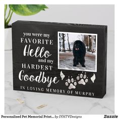 a dog memorial box with a photo and paw prints on the front, along with an inscription that reads you were my favorite hello and my hardest goodbye