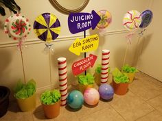 there are some decorations on the floor in front of the wall and around them is a sign that says juicing room egg sorting room