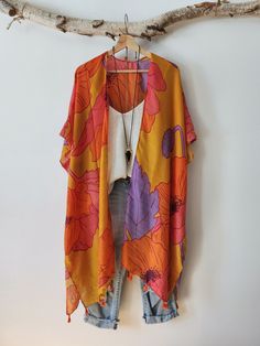 **Canadian buyers: Taxes included in the price** ♦ROYAL PURPLE♦ Add a bohemian touch to your lookbook with this bohemian kimono. Cover up in this beauty after a dip in the sea, or layer up your usual combination of top and shorts. DETAILS Colours: yellow, purple, orange and pink with orange pompom. 100% Viscose Color may vary slightly from pictures SIZE Unique size 40" long (at the longest - at the sides) 36" long (across the back) 40" Width , pit to pit or diameter ( circumference will be large Kimono Royal, Orange Bohemian Kimono With Floral Print, Yellow Bohemian V-neck Kimono, Spring Bohemian Hand-dyed Kimono, Cheap Multicolor One-size Kimono, Multicolor Printed Cover-up With Kimono Sleeves, Bohemian Kimono, Boho Kimono, Long Kimono