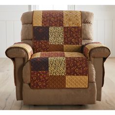 a chair with a patchwork quilt on the back and arms, in a living room