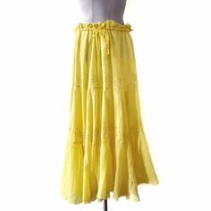 This vintage 90s/y2k skirt is export deadstock and was sourced in New Delhi. The lemon yellow maxi skirt is made of the softest cotton gauze (if you are a fan of 1970s Indian gauze, it is the same softness!). The front has embroidery and scattered sequins. The waist is a pure drawstring with no elastic, and thus can be labelled "free size" (see measurements for max size), and adjusted accordingly. The skirt is lined with the same light and airy cotton fabric to help with transparency. The hemlin Yellow Maxi Skirt, Yellow Maxi Skirts, Gauze Skirt, Gauze Skirts, Y2k Skirt, Yellow Maxi, Indian Cotton, Lemon Yellow, New Delhi