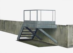 a concrete bridge with stairs going up to the top