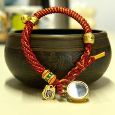 a close up of a bracelet on a table