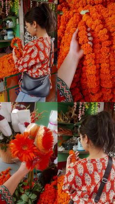 a woman arranging orange flowers in a flower shop while another woman arranges them on the shelf