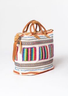 Travel in style with this ultra-bohemian weekender travel bag. A colorful statement piece featuring embroidered details, a zip-top closure, and suede trim. The large carry-all size is perfect for last-minute getaways. Embroidered Stitch details Zip-top closure Suede leather top handles Leather shoulder strap Bohemian weekender bag Dimensions: 24" X 17 3/4"Style: DR-8474 Embroidered Canvas Shoulder Bag For Travel, Multicolor Shoulder Bag With Luggage Sleeve For Trips, Bohemian Multicolor Travel Satchel, Bohemian Multicolor Bags With Zipper Closure, Bohemian Multicolor Bags With Zipper, Bohemian Rectangular Weekender Bag With Luggage Sleeve, Travel Woven Satchel, Woven Canvas Shoulder Bag For Travel, Bohemian Weekender Tote Bag For Daily Use