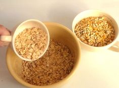 two bowls filled with oatmeal next to each other on a white table