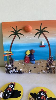 two plates with food on them sitting in front of a painted beach scene and palm trees