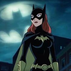 batgirl from batman the animated series standing in front of a building at night with her hands on her hips