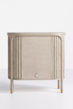 the sideboard is made out of wood and has three drawers