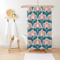 a shower curtain with pink flowers and green leaves on it in a white bathroom next to a bathtub