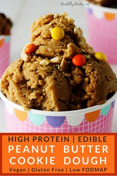 high protein edible peanut butter cookie dough in a paper cup with candy candies on top