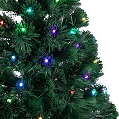 a green christmas tree with multi - colored lights