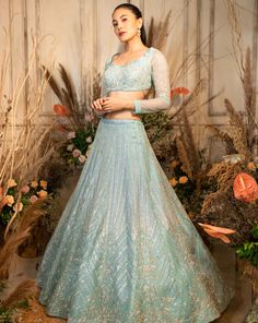 This powder blue flowy organza lehenga is embellished with silver glass beads and sequins and paired with a full-sleeved blouse and net dupatta.by Chamee and Palak. DELIVERY TIMEPlease allow 4-6 months for your outfit to arrive. FABRIC DETAILSOrganza, Net. Organza Sharara With Long Sleeves For Reception, Blue Sequined Sets For Wedding, Blue Sequined Wedding Set, Elegant Light Blue Lehenga For Reception, Hand Embellished Organza Party Wear Choli, Elegant Light Blue Lehenga For Festive Occasions, Blue Anarkali Set With Sequins For Reception, Elegant Light Blue Choli For Festive Occasions, Light Blue Resham Embroidery Choli For Wedding