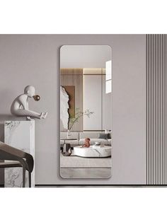 a mirror that is next to a wall