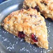 two scones sitting on top of a metal plate