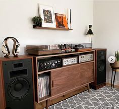 a record player and stereo system in a living room