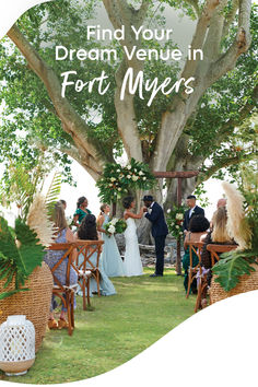 a couple getting married under a large tree