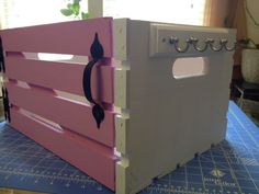 a pink and white stove top oven on a table