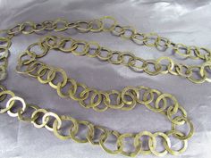 Long antique Tunisian Rhiana necklace Traditional necklace of flattened circles forming a chain Copper with gilding The gilding is much erased! 61cm long (24") 2cm ring width (0.78") 85g Tunisian craftsmanship. Good antique condition Wear of time The gilding is very faded Very beautiful piece, authentic ethnic jewelry! Have questions? Want to see more photos? Message me! The price of the item includes shipping Your Package Will Be send by registered mail (without insurance) Effective Within 72 hours your payment from France. An Email Will Be send to confirm your tracking number. Thank you very much for your visit. Vintage Gold Hand Forged Necklaces, Vintage Gold Hand Forged Necklace, Vintage Hand Forged Gold Necklace, Gold Oxidized Finish Chain Necklace As Gift, Gold Chain Necklace With Oxidized Finish As Gift, Gold Oxidized Long Necklace, Antique Gold Brass Chain Necklace, Antique Oxidized Gold Necklace, Antique Gold Chain Necklace In Brass