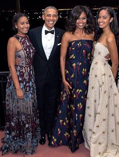 the obama family is posing for a photo in their evening gowns and tuxedos